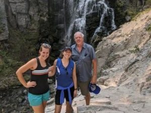 Jamie and her family at a waterfall
